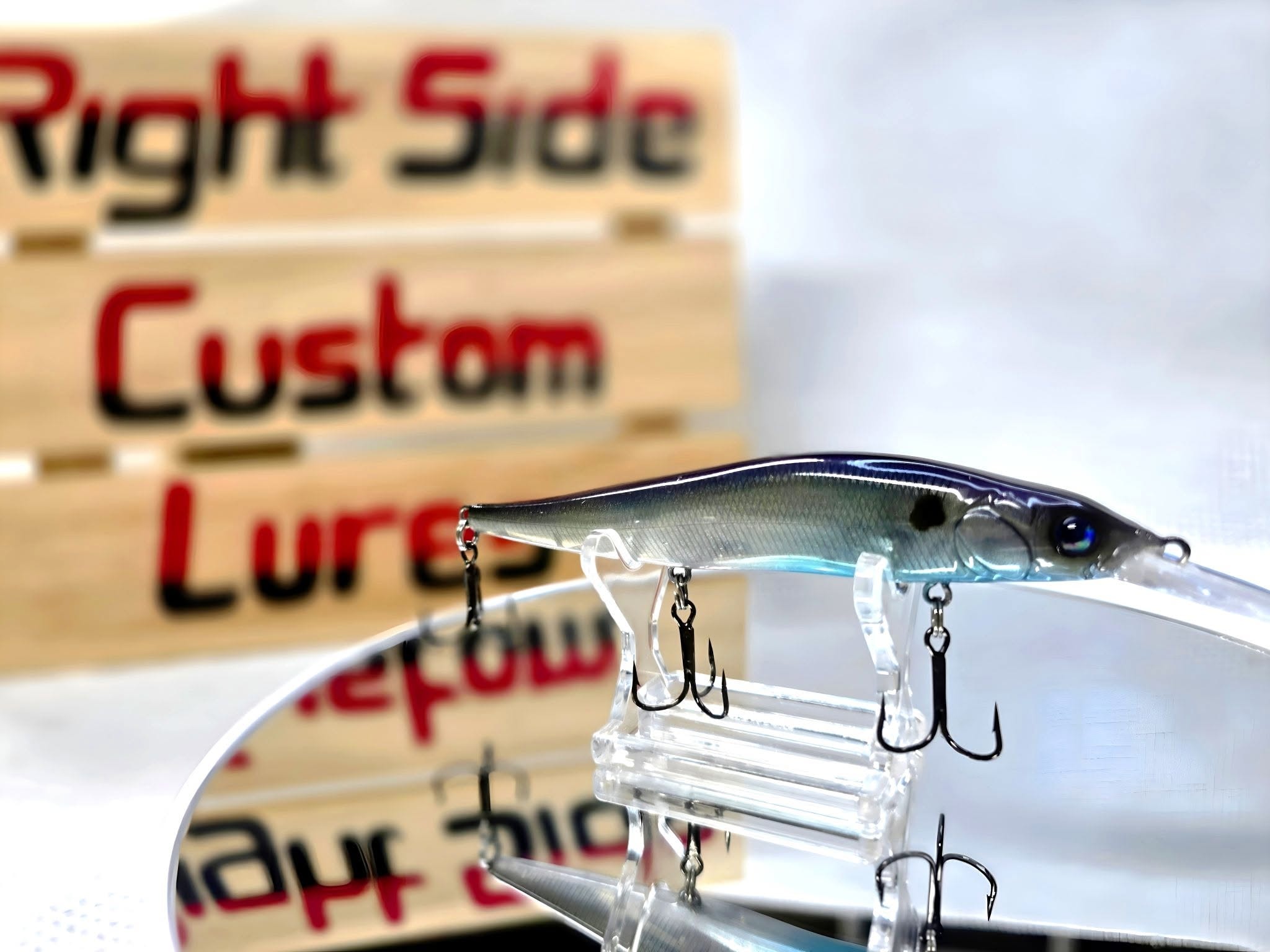 Brock Reynolds hand painting a custom fishing lure